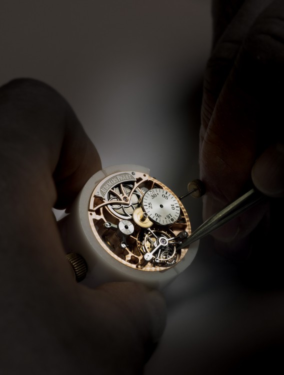 Watchmaker working on calibre